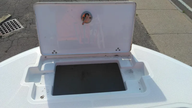 Slide: The Image of Open storage compartment on a 2021 Wellcraft 202 Fisherman boat. - 30