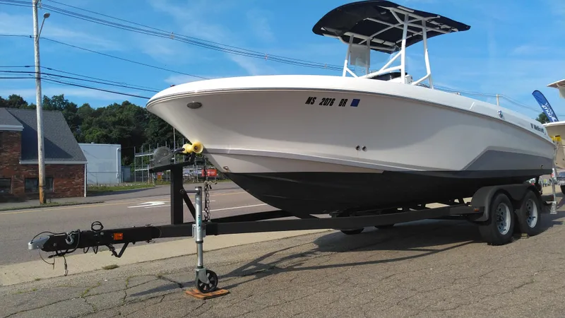 Slide: The Image of 2021 Wellcraft 202 Fisherman boat on a trailer, parked on a street. - 33