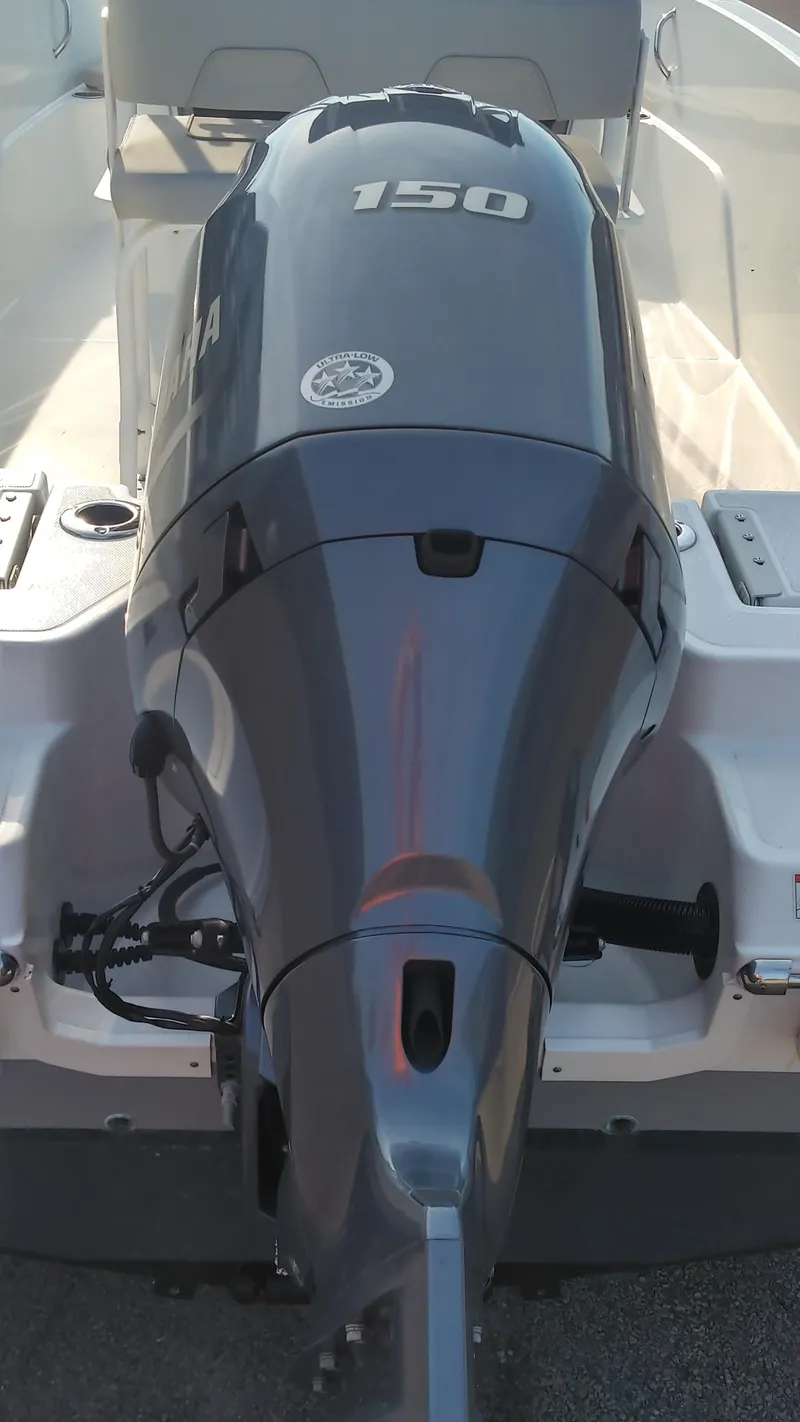 Slide: The Image of 2021 Wellcraft 202 Fisherman boat with a 150 HP outboard motor. - 9