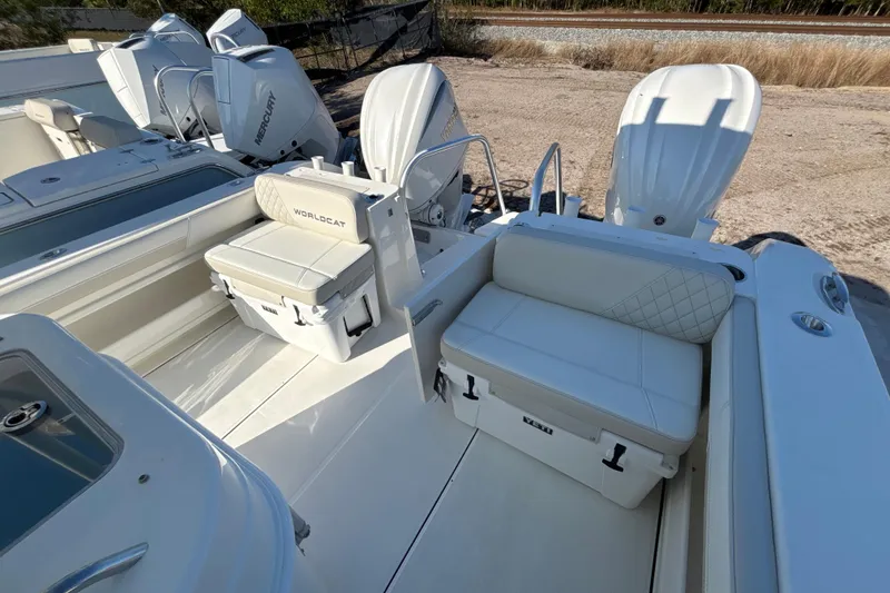 Slide: The Image of 2026 World Cat 295 CC boat interior with seating and Mercury engines. - 4