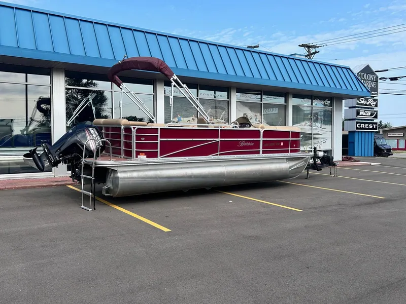 Slide: The Image of 2015 Berkshire 210CL CTS pontoon boat parked outside a dealership. - 4