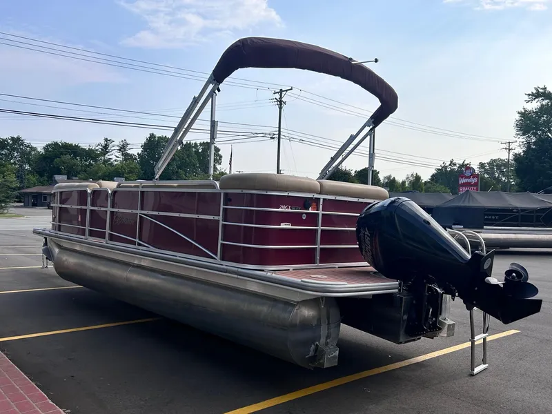 Slide: The Image of 2015 Berkshire 210CL CTS pontoon boat with outboard motor in parking lot. - 7