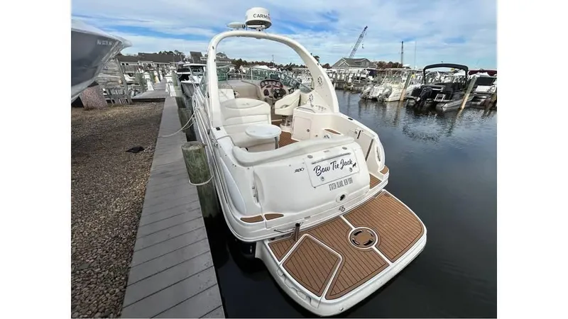 The Image of 2005 Sea Ray 280 Sundancer docked at marina, rear view. - 0