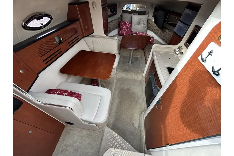 Slide: The Image of Interior of 2005 Sea Ray 280 Sundancer boat with seating and dining area. - 11