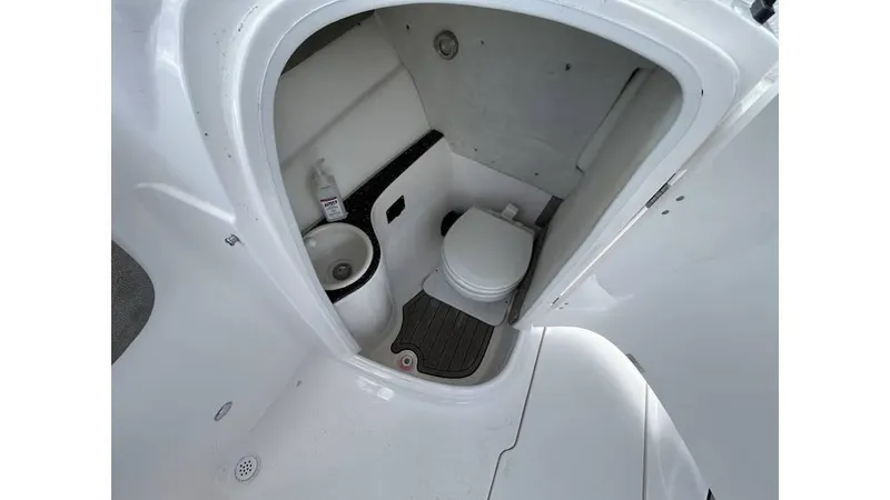 Slide: The Image of 2023 Sea Fox 226 Traveler boat interior with compact marine toilet. - 10