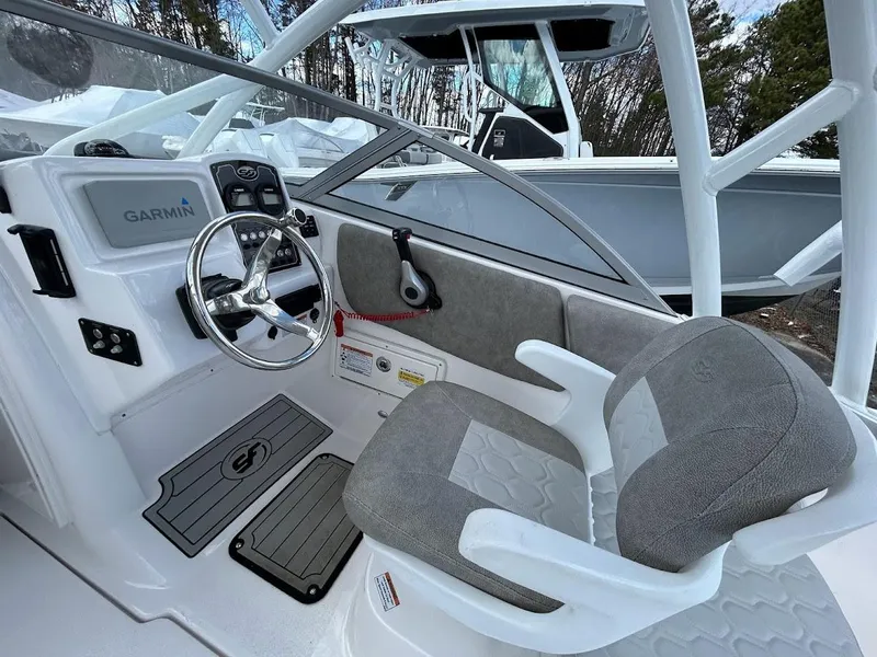 Slide: The Image of 2023 Sea Fox 226 Traveler boat interior with Garmin system and comfortable seating. - 12