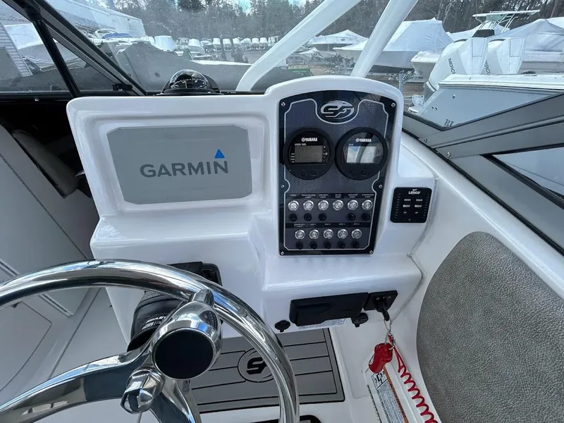 Slide: The Image of 2023 Sea Fox 226 Traveler dashboard with Garmin navigation system and control panel. - 14