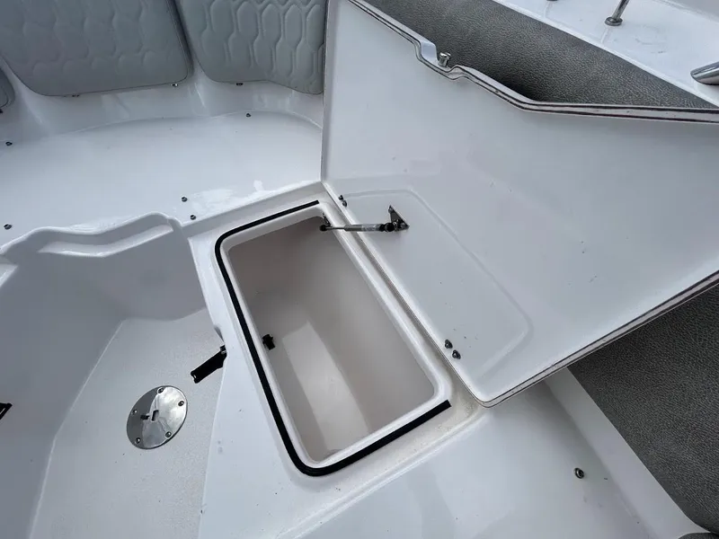 Slide: The Image of 2023 Sea Fox 226 Traveler boat storage compartment open, showcasing interior space. - 19