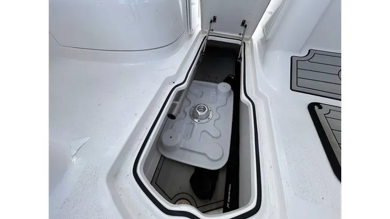 Slide: The Image of 2023 Sea Fox 226 Traveler storage compartment with lid open. - 21