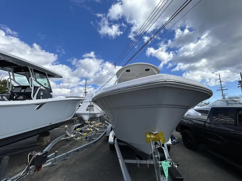 Slide: The Image of 2023 Sea Fox 226 Traveler boat on trailer under cloudy sky. - 5