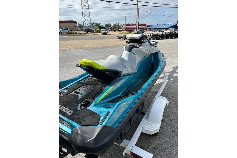 Slide: The Image of 2024 Sea-Doo GTI SE 130 jet ski on trailer, vibrant blue and gray design. - 5