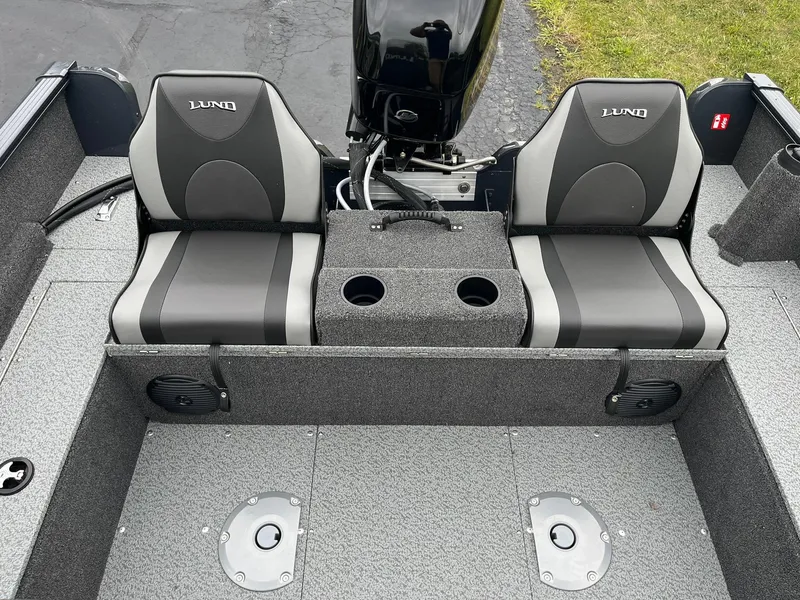 Slide: The Image of 2025 Lund 1650 Rebel XL SS boat interior with dual seats and motor. - 13