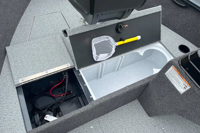 Slide: The Image of 2025 Lund 1650 Rebel XL SS boat storage compartments with fishing net and equipment. - 16