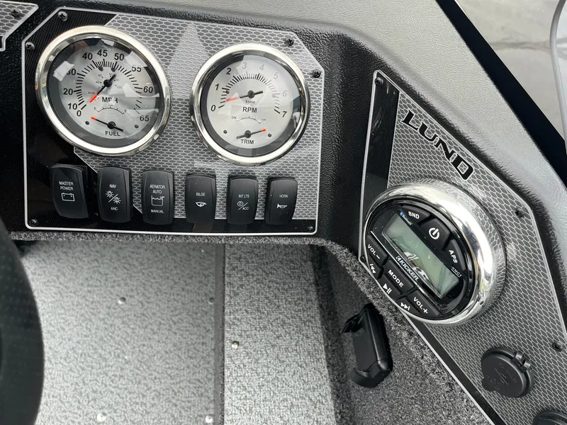 Slide: The Image of Dashboard of 2025 Lund 1650 Rebel XL SS boat with gauges and controls. - 21
