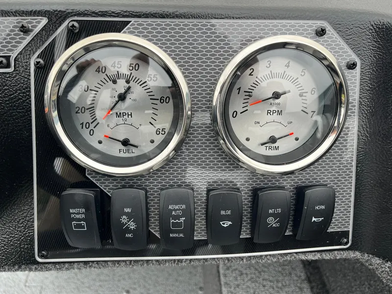 Slide: The Image of Dashboard of 2025 Lund 1650 Rebel XL SS with speedometer and RPM gauges. - 23