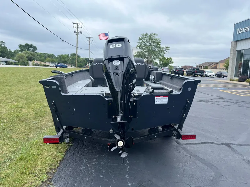 Slide: The Image of 2025 Lund 1650 Rebel XL SS boat with 60 HP motor on trailer. - 3
