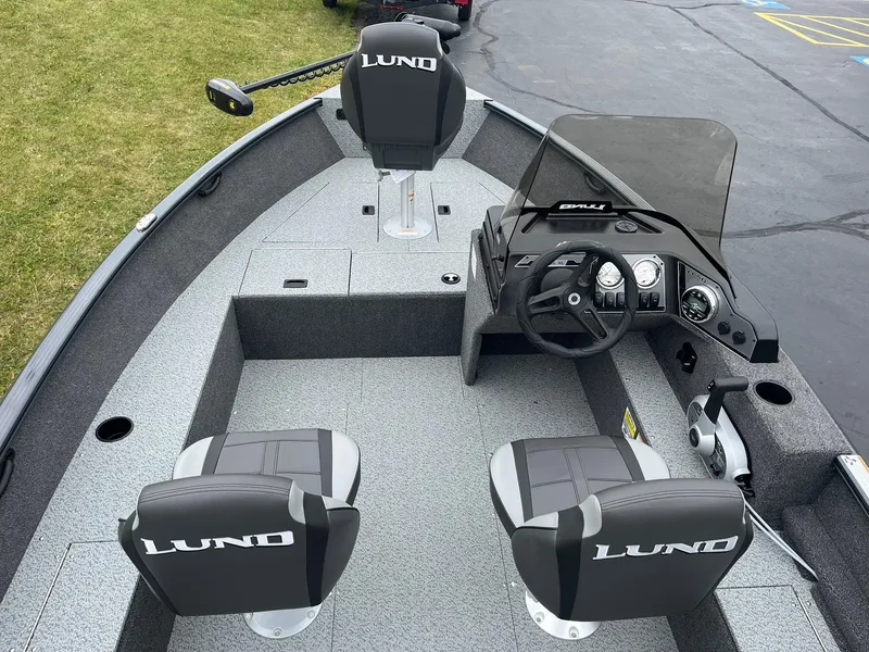 Slide: The Image of 2025 Lund 1650 Rebel XL SS boat interior with steering console and seating. - 6