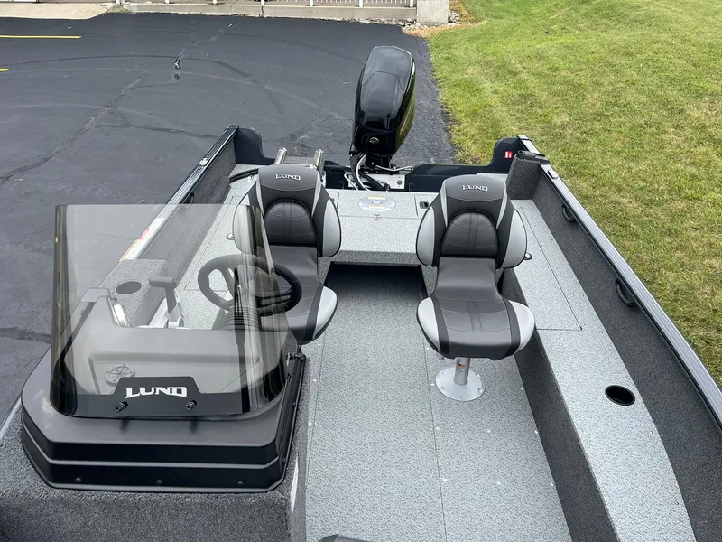 Slide: The Image of 2025 Lund 1650 Rebel XL SS boat interior with dual seats and steering console. - 9