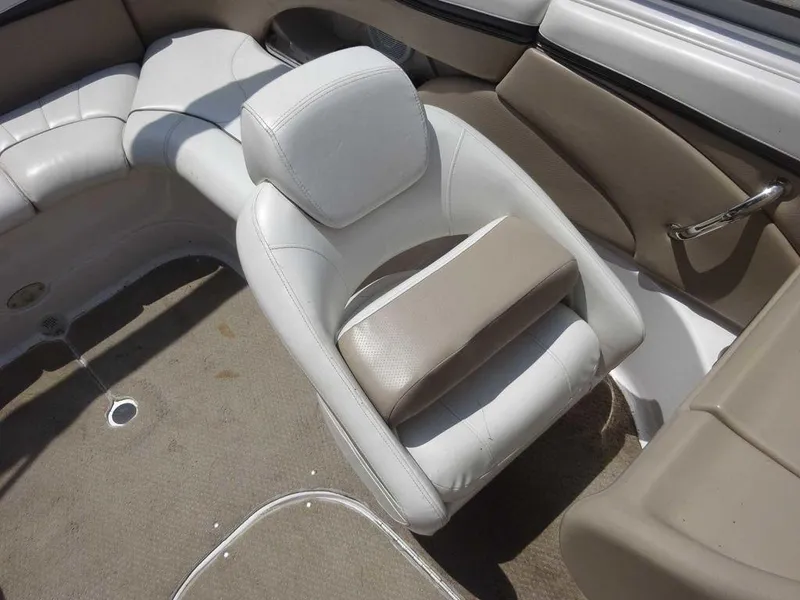 Slide: The Image of 2006 Four Winns H220 boat interior with beige and white seating. - 10