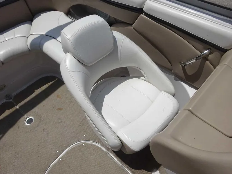 Slide: The Image of 2006 Four Winns H220 boat interior with white and beige seating. - 17