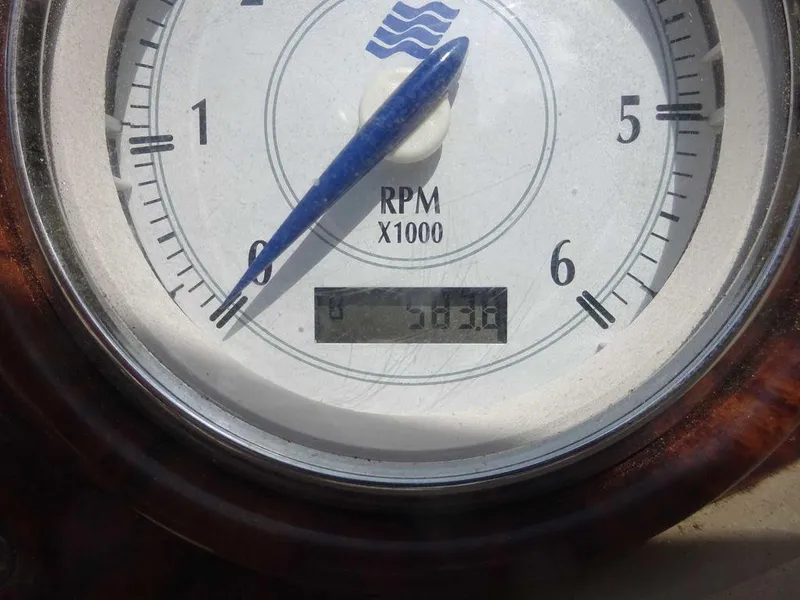 Slide: The Image of Tachometer of 2006 Four Winns H220 boat showing RPM and digital display. - 18