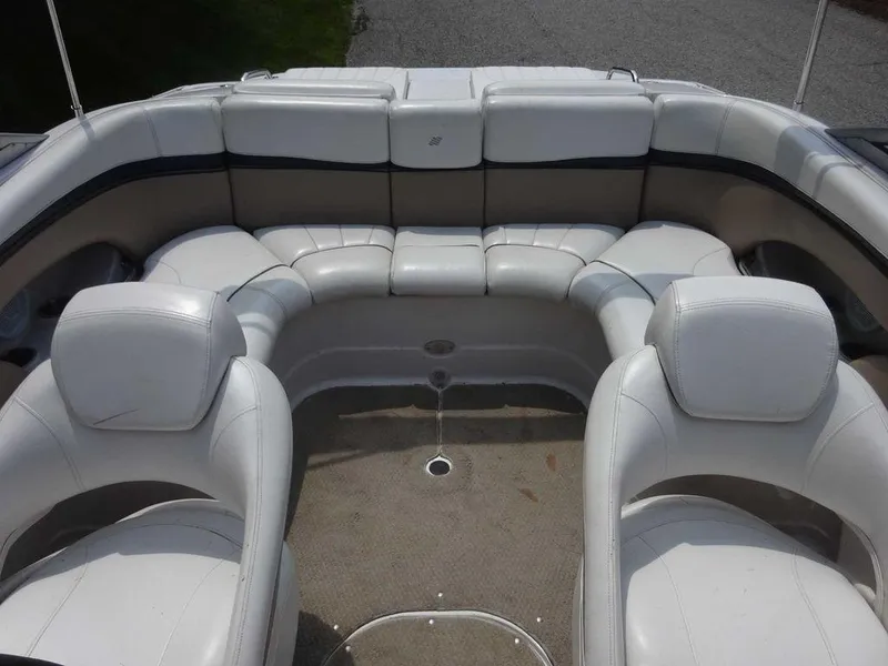 Slide: The Image of 2006 Four Winns H220 boat interior with white seating and spacious layout. - 20