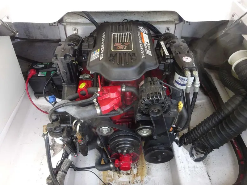 Slide: The Image of Engine compartment of a 2006 Four Winns H220 boat, featuring a Volvo Penta engine. - 22