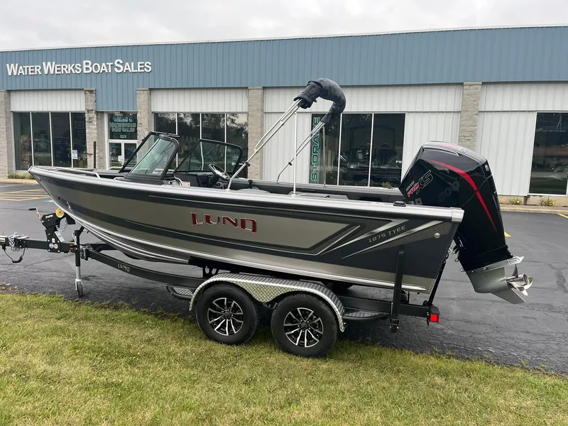 Slide: The Image of 2025 Lund 1875 Tyee boat on trailer outside Water Werks Boat Sales. - 1