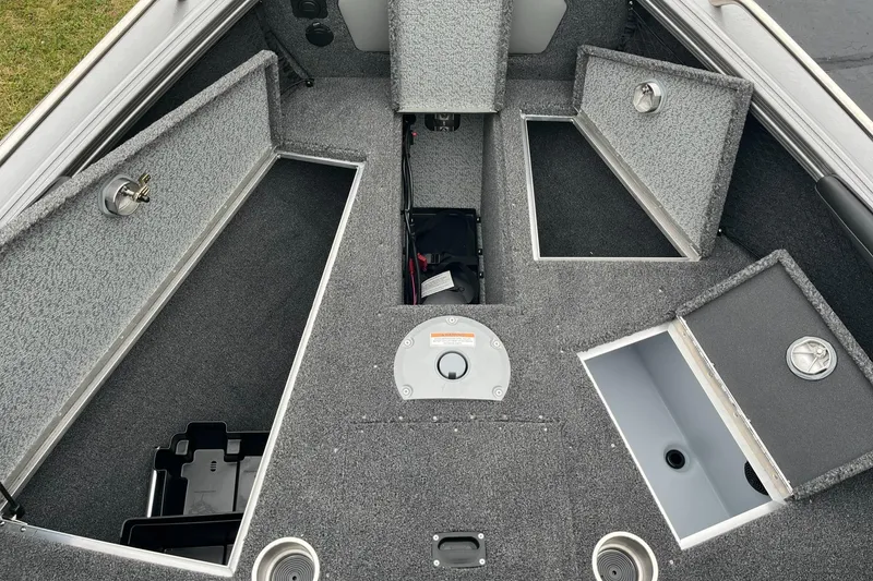Slide: The Image of 2025 Lund 1875 Tyee boat interior with open storage compartments. - 12