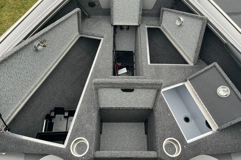 Slide: The Image of 2025 Lund 1875 Tyee boat interior with open storage compartments. - 13