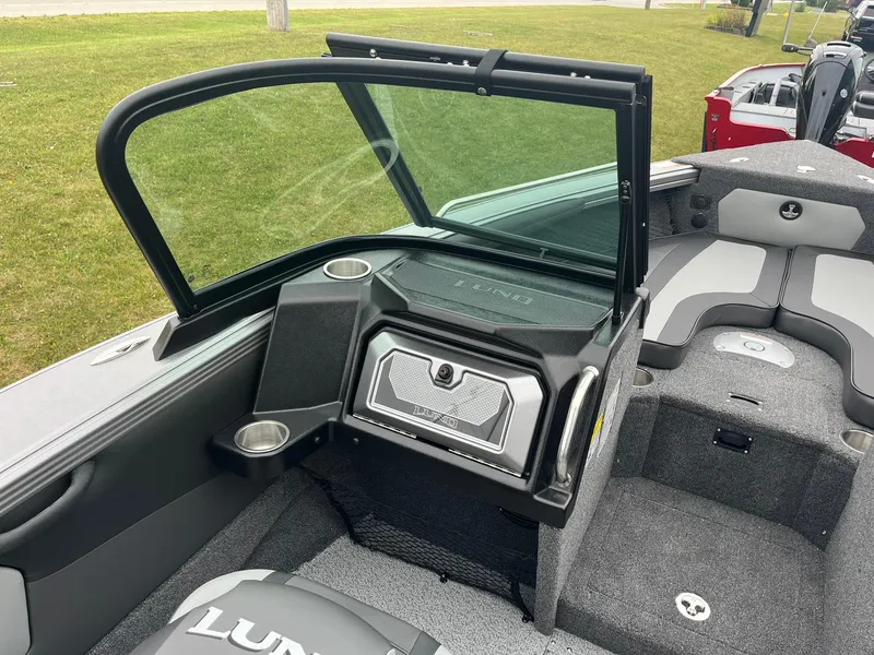 Slide: The Image of 2025 Lund 1875 Tyee boat interior with windshield and seating area. - 14