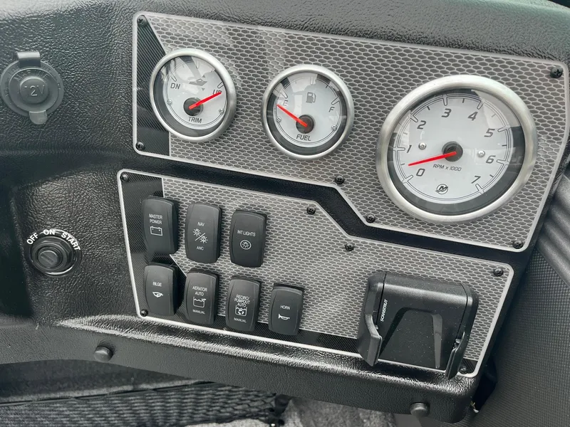 Slide: The Image of Dashboard of 2025 Lund 1875 Tyee boat with gauges and switches. - 17