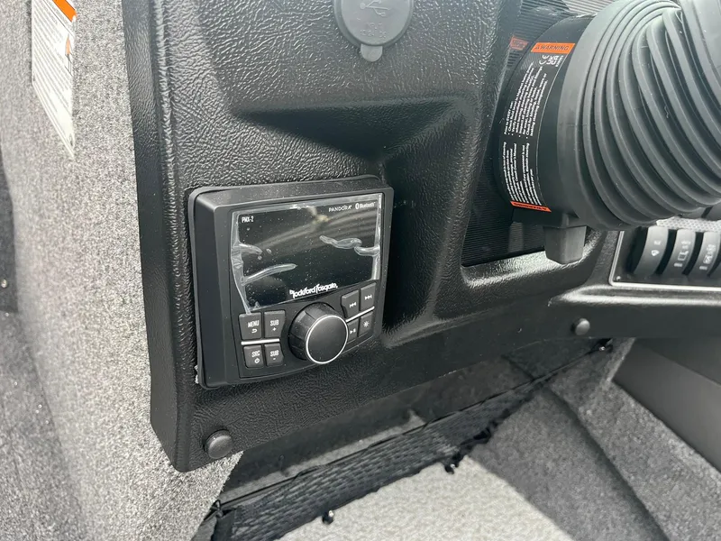 Slide: The Image of 2025 Lund 1875 Tyee boat dashboard with Rockford Fosgate audio system. - 18