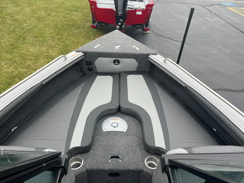 Slide: The Image of 2025 Lund 1875 Tyee boat interior with cushioned seating and storage compartments. - 20