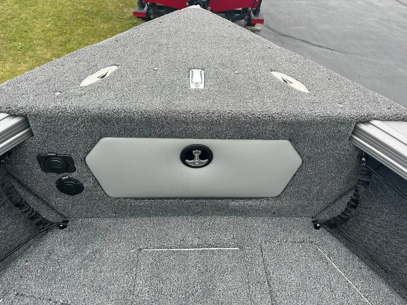 Slide: The Image of 2025 Lund 1875 Tyee boat interior with gray carpeted deck. - 21