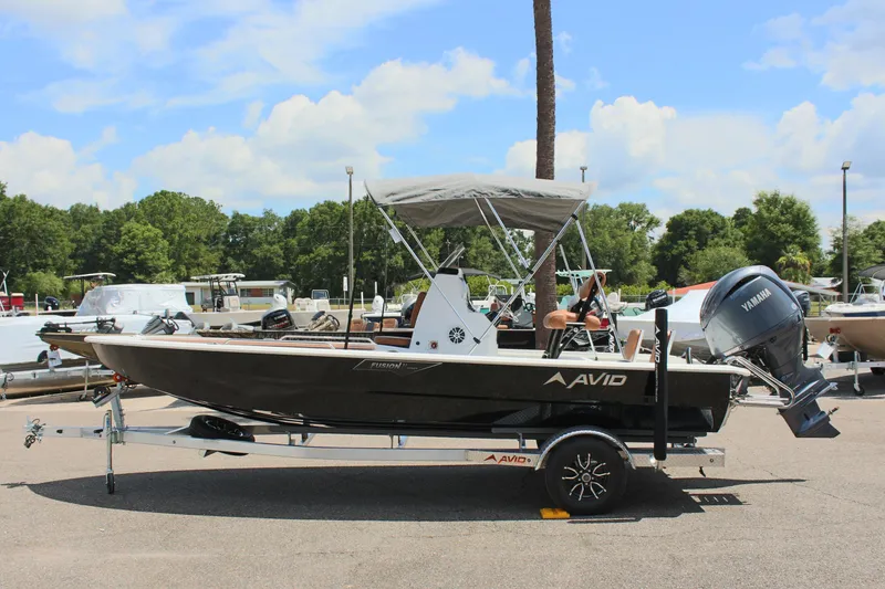 The Image of 2024 Avid 21 Fusion boat on trailer with Yamaha outboard motor. - 0