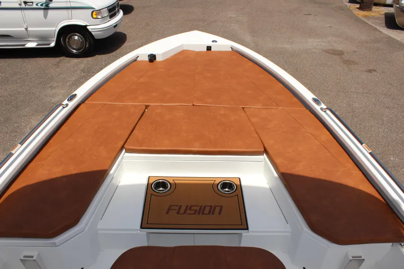 Slide: The Image of 2024 Avid 21 Fusion boat with brown cushioned deck. - 23
