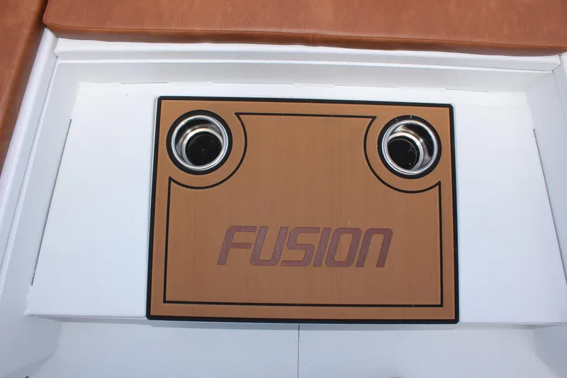 Slide: The Image of 2024 Avid 21 Fusion boat deck with cup holders and Fusion logo. - 24