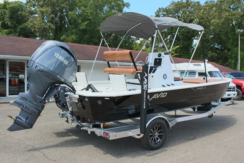 Slide: The Image of 2024 Avid 21 Fusion boat with Yamaha outboard motor on a trailer. - 6