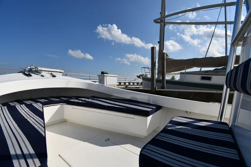 Slide: The Image of 2021 Eastern 248 Center Console boat with striped seating at a marina. - 20