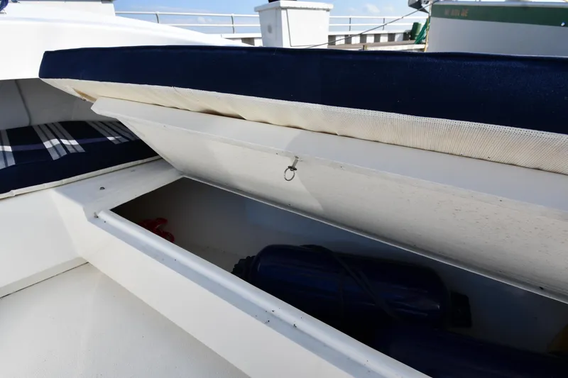 Slide: The Image of Open storage compartment on a 2021 Eastern 248 Center Console boat. - 27