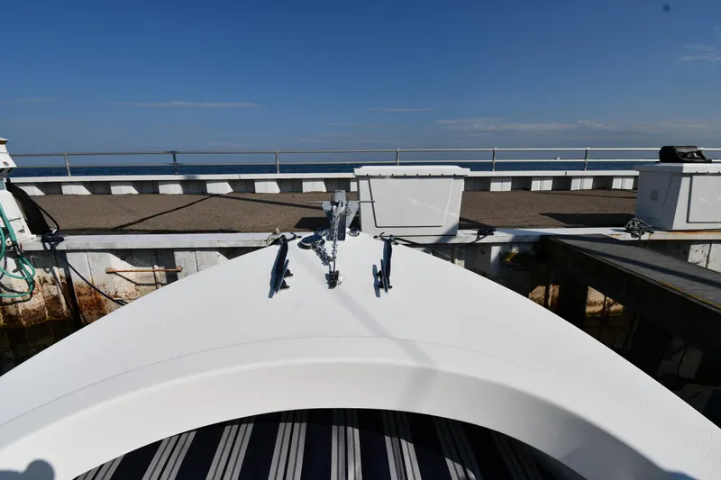 Slide: The Image of 2021 Eastern 248 Center Console boat docked at a marina. - 3