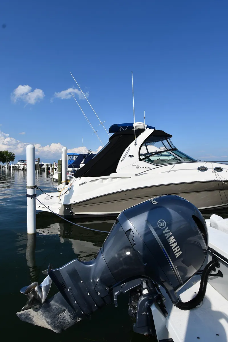 Slide: The Image of 2021 Eastern 248 Center Console boat docked with Yamaha outboard motor. - 37