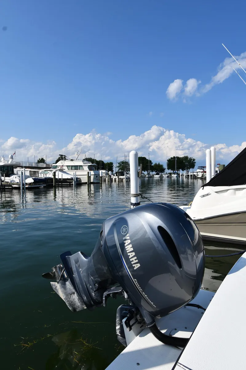 Slide: The Image of 2021 Eastern 248 Center Console boat with Yamaha outboard motor docked at marina. - 38