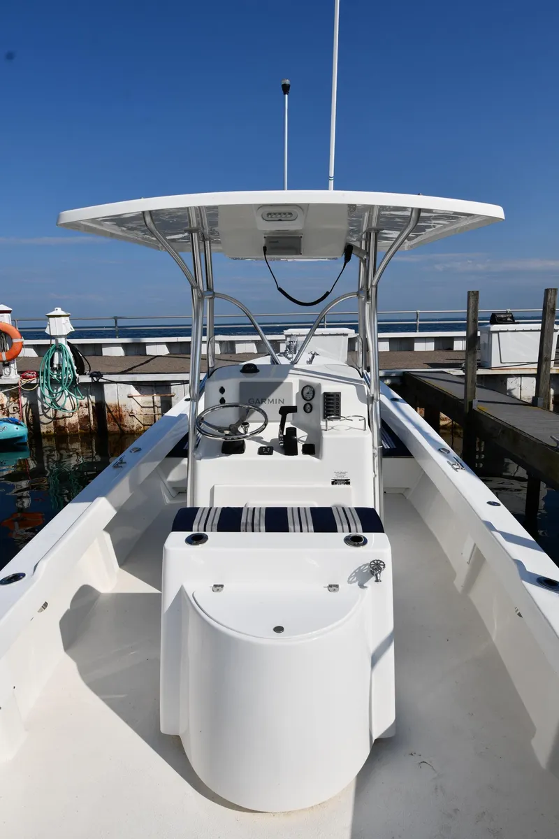 Slide: The Image of 2021 Eastern 248 Center Console boat docked at a marina. - 7