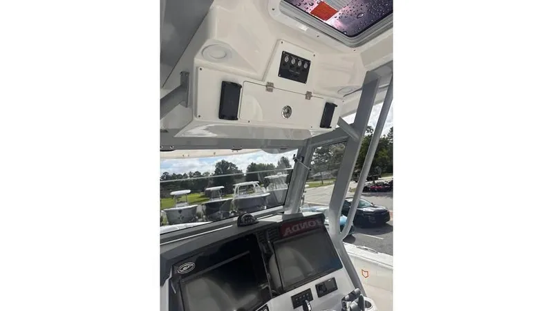 Slide: The Image of 2025 Sea Fox 328 Commander boat cockpit with advanced navigation system. - 11