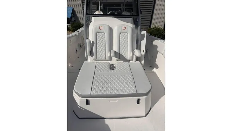 Slide: The Image of 2025 Sea Fox 328 Commander boat seating area with diamond-stitched upholstery. - 13