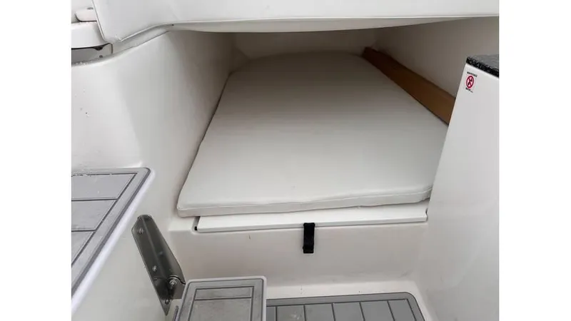 Slide: The Image of 2025 Sea Fox 328 Commander cabin interior with cushioned bed. - 16