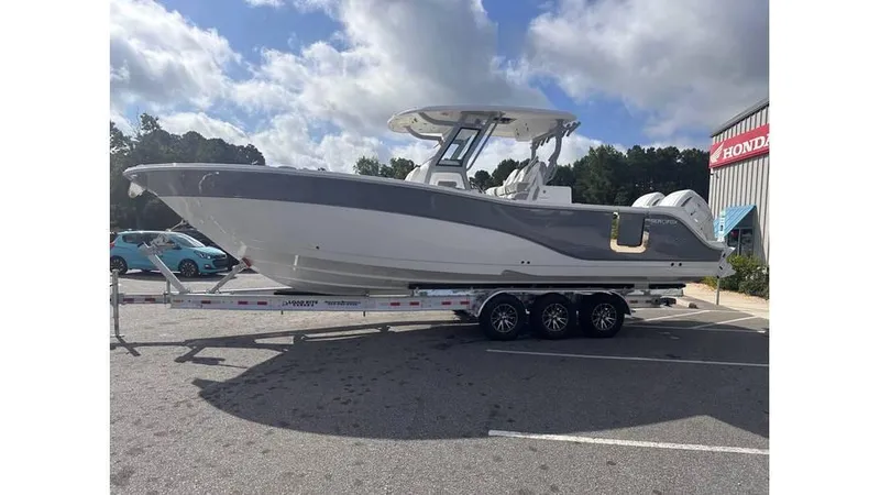 Slide: The Image of 2025 Sea Fox 328 Commander boat on a trailer in a parking lot. - 2