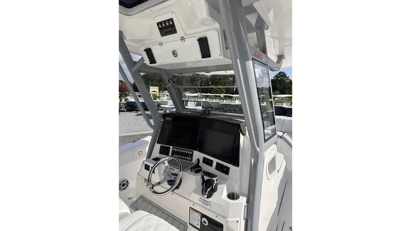 Slide: The Image of 2025 Sea Fox 328 Commander boat helm with advanced navigation systems. - 24